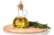 Oil in a bottle and fresh rosemaryon wooden board isolated