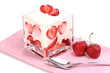 Glass of ripe strawberries with cream isolated on white