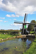 Photo: The windmill is reflected in the channel The windmill is reflected in the channel