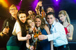 People in club or bar drinking beer