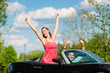 Foto: Young couple with cabriolet in summer on day trip Young couple with cabriolet in summer on day trip