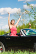 Foto: Young couple with cabriolet in summer on day trip Young couple with cabriolet in summer on day trip
