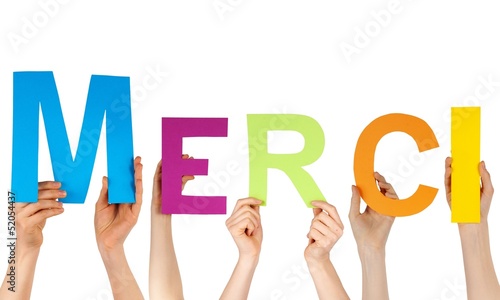 Photo: hands holding the letters MERCI hands holding the letters MERCI