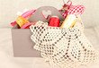 Photo: Box with the materials at hand sewing on white background Box with the materials at hand sewing on white background