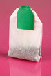Tea bag on pink background