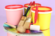 Set for painting: paint pots, brushes, paint-roller, palette of