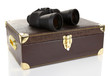 Black modern binoculars with suitcase isolated on white