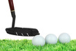 Golf balls and driver on grass isolated on white