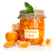 Orange jam with zest and tangerines, isolated on white