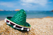 Green Spanish straw hat at beach