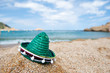 Green Spanish straw hat at beach
