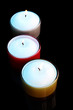 Photo: Candles isolated on black Candles isolated on black