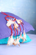 Beautiful dream catcher and pillows on blue background