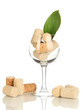 Wineglass and corks isolated on white