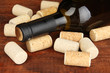 Wine and corks on wooden table