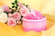 Beautiful gift on flowers background