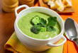 Broccoli cream soup on table