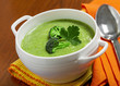 Broccoli cream soup on a tablecloth