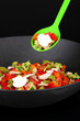 Vegetable ragout in wok, isolated on black