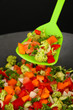 Vegetable ragout in wok, isolated on black