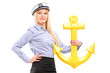 Foto: A young sailor woman with an anchor A young sailor woman with an anchor
