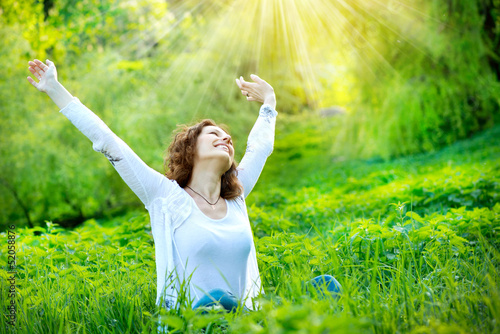 Photo: Beautiful Young Woman Outdoors. Enjoy Nature Beautiful Young Woman Outdoors. Enjoy Nature