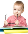 Little child play with book