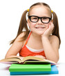 Little girl is reading a book