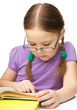Little girl is reading a book