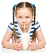 Cute little girl with a glass of milk