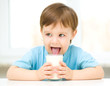 Foto: Cute little boy with a glass of milk Cute little boy with a glass of milk