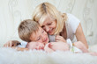 Photo: happy family with newborn baby at home happy family with newborn baby at home