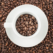 Cup full of coffee beans