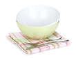Salad bowl and silverware over kitchen towel