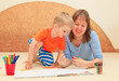 mother and son drawing together