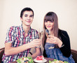 Foto: Young, attractive, happy, smiling couple celebrating with champa Young, attractive, happy, smiling couple celebrating with champa