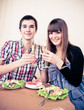 Foto: Young, attractive, happy, smiling couple celebrating with champa Young, attractive, happy, smiling couple celebrating with champa