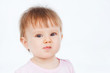 Portrait of funny baby, on a gray background