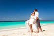Foto: Bride and groom having fun on beach Bride and groom having fun on beach