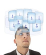 Young man looking at his virtual friends isolated on white