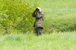 Wildlife photographer with long telephoto