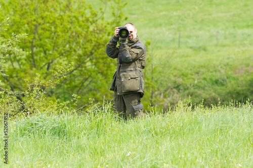 Photo: Wildlife photographer with long telephoto Wildlife photographer with long telephoto