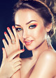 Model with Coral makeup and manicure