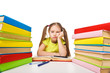 Foto: Bored schoolgirl with pile of books. homework Bored schoolgirl with pile of books. homework