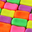 Wall background made of colorful child's play clay bricks