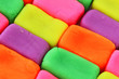 Wall background made of colorful child's play clay bricks