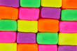 Wall background made of colorful child's play clay bricks