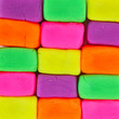 Wall background made of colorful child's play clay bricks