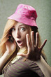 Photo: young woman shocked while gossiping on phone young woman shocked while gossiping on phone