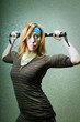 Photo: Funny sports girl in with big biceps and spring bar Funny sports girl in with big biceps and spring bar